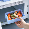 Double-Layer 1200 ml Plastic Lunch Box with Spoon holding sushi and vegetables, designed for microwave use.