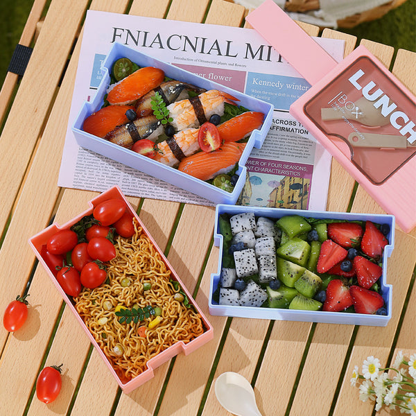 Double-Layer 1200 ml Plastic Lunch Box with Spoon featuring stacked compartments filled with food.