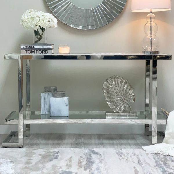 Double Tier Silver Console Table styled with decorative items and a mirror, perfect for modern interiors.