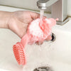 Double-sided Pet Grooming Brush with soap and water, used for effective pet bathing and grooming.