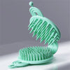 Double-sided Pet Grooming Brush in teal color with two brush sides for easy pet grooming.