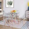 Durable Acrylic Transparent Table Set featuring a round glass table and four acrylic shell chairs in a modern dining room.
