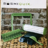 Easy Roll Sushi Maker Kit including various sushi-making tools arranged on a wooden surface.