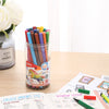 Fibre Tip Water Colour Marker Pen Set of 12 in a jar on a desk with colorful notes and flowers.