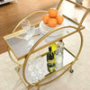 2 Tier Mobile Serving Trolley with glassware, bottles, and oranges on mirrored shelves.