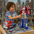 Child playing with 2-in-1 Deformation Truck Robot Toy transforming between truck and robot modes.