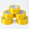 Secure Seal Clear Packing Tape Roll - stack of yellow packing tape rolls for secure sealing.