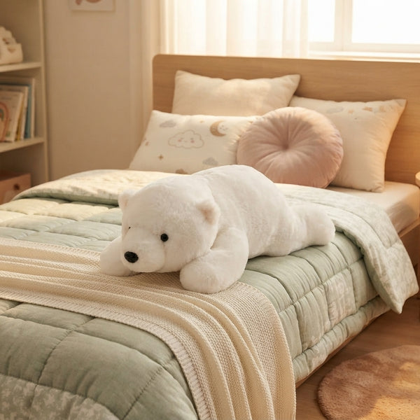 Polar Bear Plush Toy resting on a bed with light green bedding, perfect for children's playtime and bedroom décor.