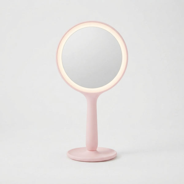 LED Hand Mirror with Integrated Lighting in pink with built-in LED illumination for everyday grooming.