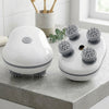 4-Head Cordless Electric Massager on a kitchen countertop showcasing its compact design and four massage heads.
