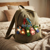 Pixel Character Light-Up Keychain displayed on a backpack, adding playful illumination and style.