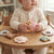 Baby Sensory Rattle & Teether Toy Set featuring colorful animal shapes for infants on a wooden table.