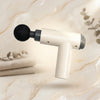 Portable Handheld Massage Gun with round attachment on a stylish background for effective vibration therapy.