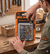 16-Piece Wall Screw and Plug Fixing Kit displayed by a person, showcasing reliable hardware for home improvement.
