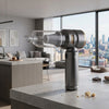 Handheld Portable Vacuum Cleaner on a kitchen countertop, ideal for quick clean-ups in various spaces.
