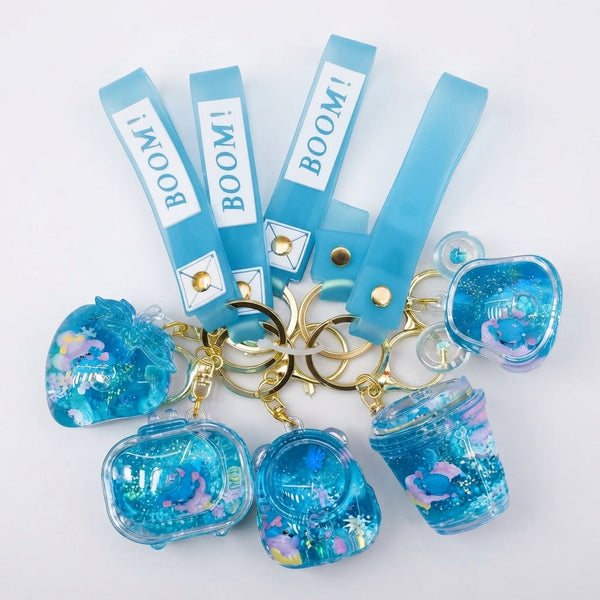 Blue Liquid-Filled Quicksand Keychain set with vibrant blue colors and decorative designs