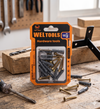 16-Piece Wall Screw and Plug Fixing Kit packaging on a wooden workbench with tools.