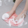 Non Slip Shower Foot Scrubber Massager in use, showing feet on a texturized surface with soap lather.