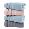 Thick Cotton Face and Hand Towel stacked in soft colors including blue, pink, and gray, emphasizing plush texture.