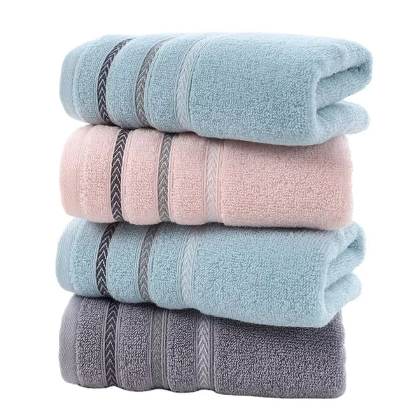 Thick Cotton Face and Hand Towel stacked in soft colors including blue, pink, and gray, emphasizing plush texture.