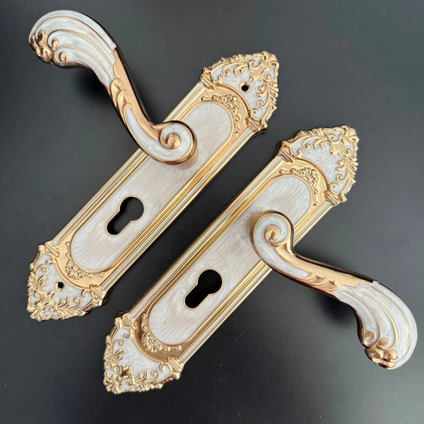 Modern White European Door Handle set featuring elegant design with ornate details and a gold finish.