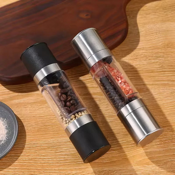 2-in-1 Stainless Steel and Bamboo Manual Grinder with salt and pepper chambers on a wooden surface.