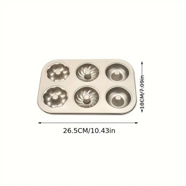 Non-Stick 6-Cavity Mini Fluted Tube Pan with three distinct fluted designs for elegant baking.