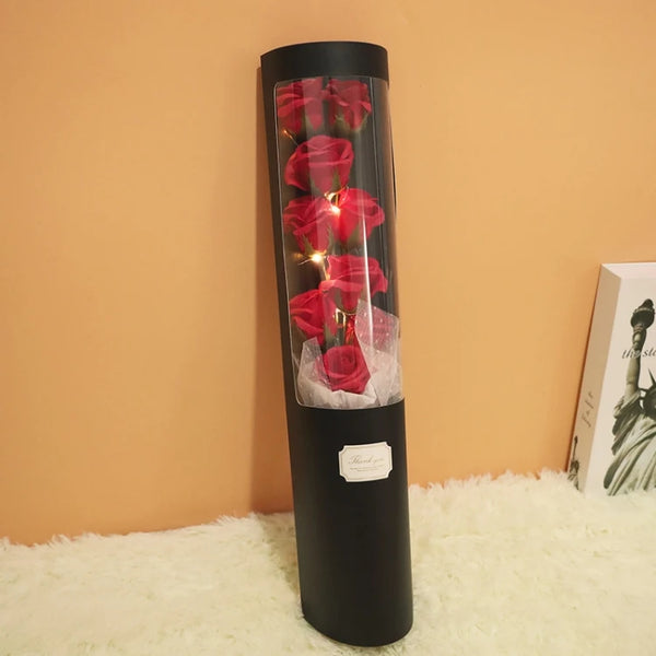 Cylinder Floral Display Box with Soap Roses showcasing elegant red roses in a tall, modern presentation.