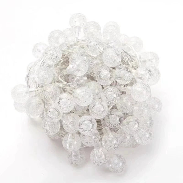 Bubble Ball Fairy String Lights with transparent mini globes, perfect for decor in gardens, trees, and wedding venues.