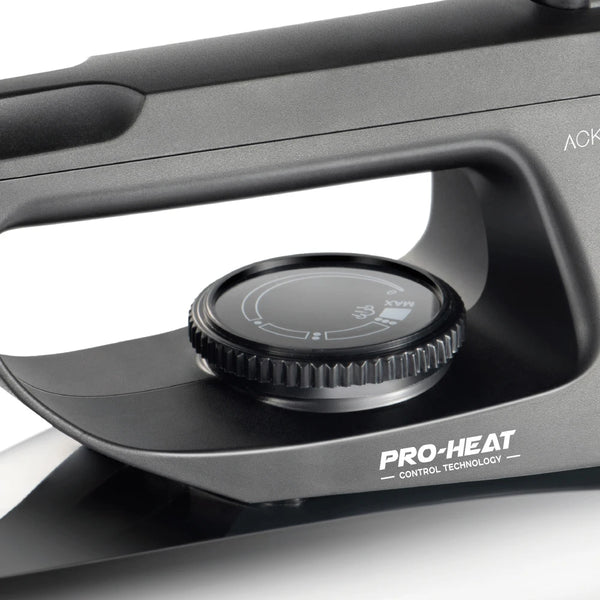 1000W Electric Dry Iron showing Pro-Heat control technology dial for precise temperature adjustment.