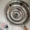 Double-Layer Iron Silver Anti-Hot Heat Diffuser with a spiral pattern and wooden handle.