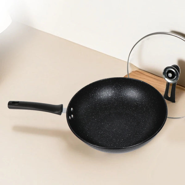 32cm Non-Stick Carbon Steel Iron Wok on a kitchen countertop with a lid, ideal for stir-frying and searing.