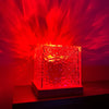 USB Ocean Wave Dynamic Water Ripple Pattern Lamp casting red flowing water-ripple light effects on walls.