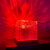USB Ocean Wave Dynamic Water Ripple Pattern Lamp casting red flowing water-ripple light effects on walls.