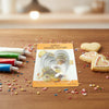 Classic 5 Piece Stainless Steel Cookie Cutter Set displayed with decorated cookies and colorful icing on a wooden surface.