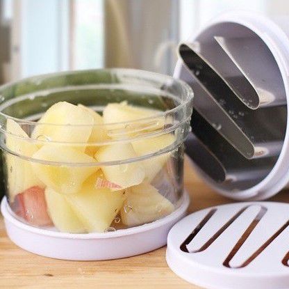 Stainless Steel Manual Food Chopper Handheld Vegetable Onion Press with diced potatoes in a clear container.