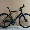 2nd Generation 24-Speed Flat Bar Road Bike in sleek black design, perfect for urban rides and fitness cycling.