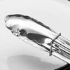 Close-up of a 3-Piece 12-Inch Stainless Steel BBQ Tong Set resting on a plate.