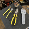 8-Inch Steel Cutting Pliers among various hand tools on a workbench, showcasing durability and reliable performance.