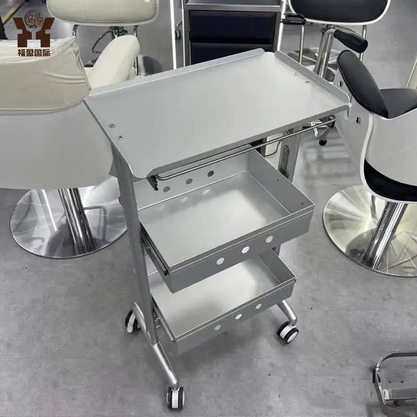 Aluminium Salon Trolley with three storage trays, designed for organized tool storage in busy salons.