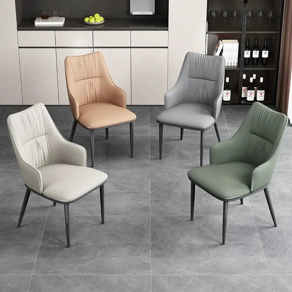 Nordic Leather Dining Chair with Metal Legs in various colors placed in a modern dining room setting.