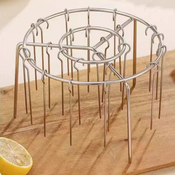 Air Fryer Barbecue Grill Rack and Skewer Set displaying a metallic grill rack on a wooden surface with a lemon.