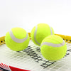 Three Anti-abrasion Practice Tennis Balls on a racquet's string bed, ideal for enhancing court performance.