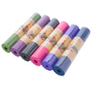 Thick Solid Yoga Mat for Fitness in various colors rolled up for easy storage.