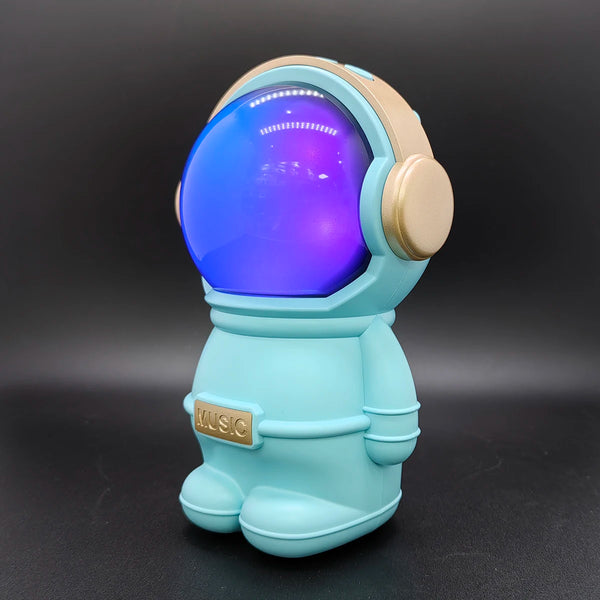 A colorful astronaut Stereo Woofer Bluetooth Speaker with a glowing helmet, showcasing a fun design for music lovers.