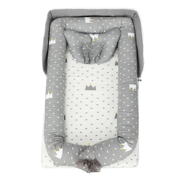 Fashionable 2 in1 Baby Travel Bed with soft gray and white crown pattern for comfort and style while traveling.