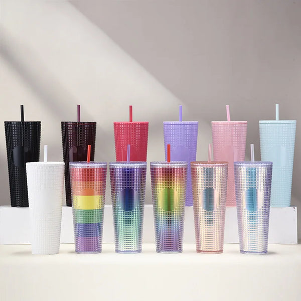 Matte Black Studded Bling Cup Tumbler collection in various colors and patterns displayed on a shelf.