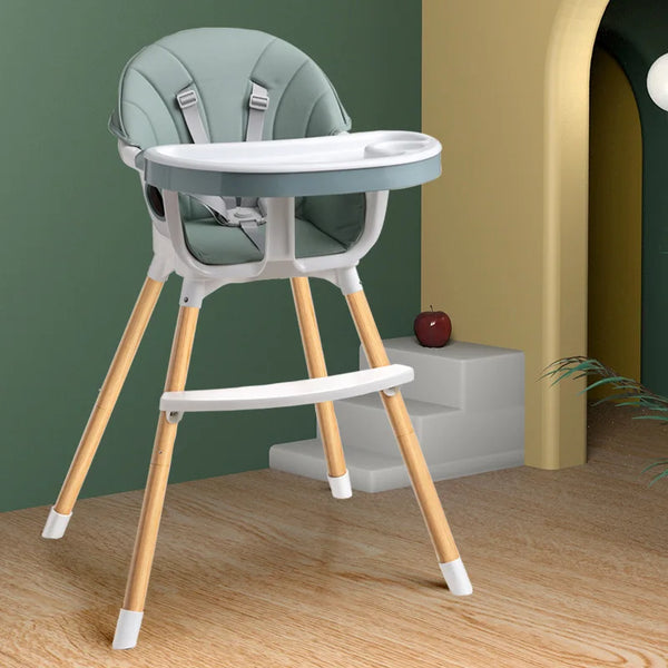 Portable Baby Booster Seat Harness in a modern setting with minimalist design and wooden legs, perfect for mealtimes.