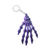3D Printed Skull Hand Keychain Pendant in purple color with detailed skeleton design for unique style.