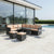 Modern Iron PE Rattan Outdoor Furniture Set in a stylish outdoor patio by the poolside.